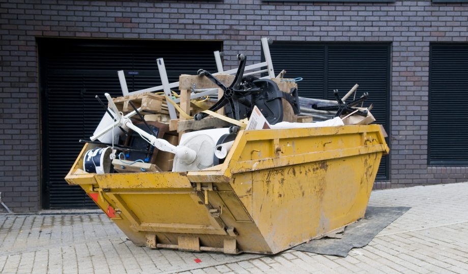 Industrial Skip, Overflowing Skip to represent waste and social value