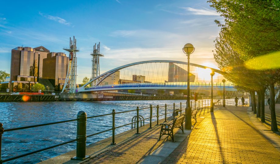View of a footbridge in Salford quays in Manchester, England View of a footbridge in Salford quays in Manchester, England