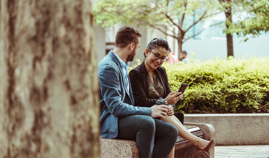 A young business partner sit on the bench A young business partner sit on the bench